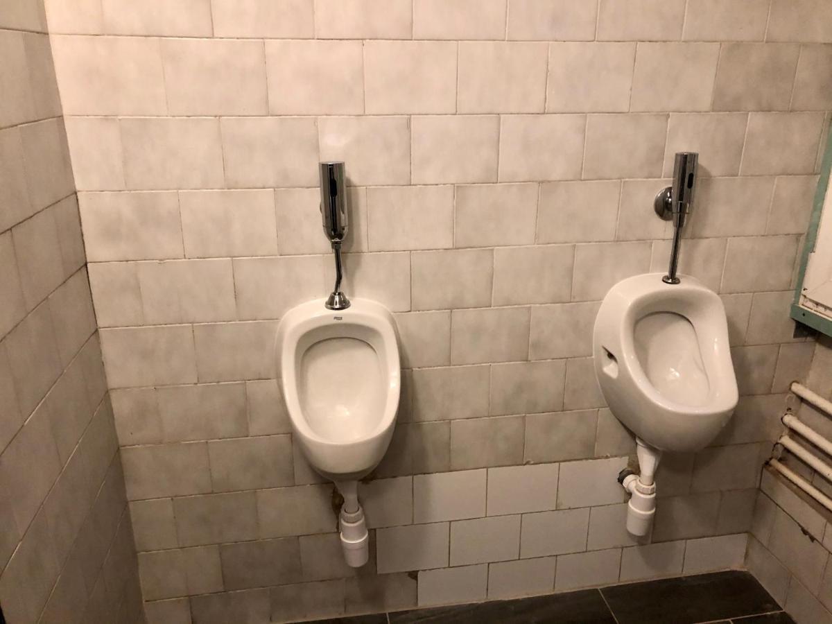 A men's bathroom that only has 4 long urinals and no toilet. :  r/CrappyDesign